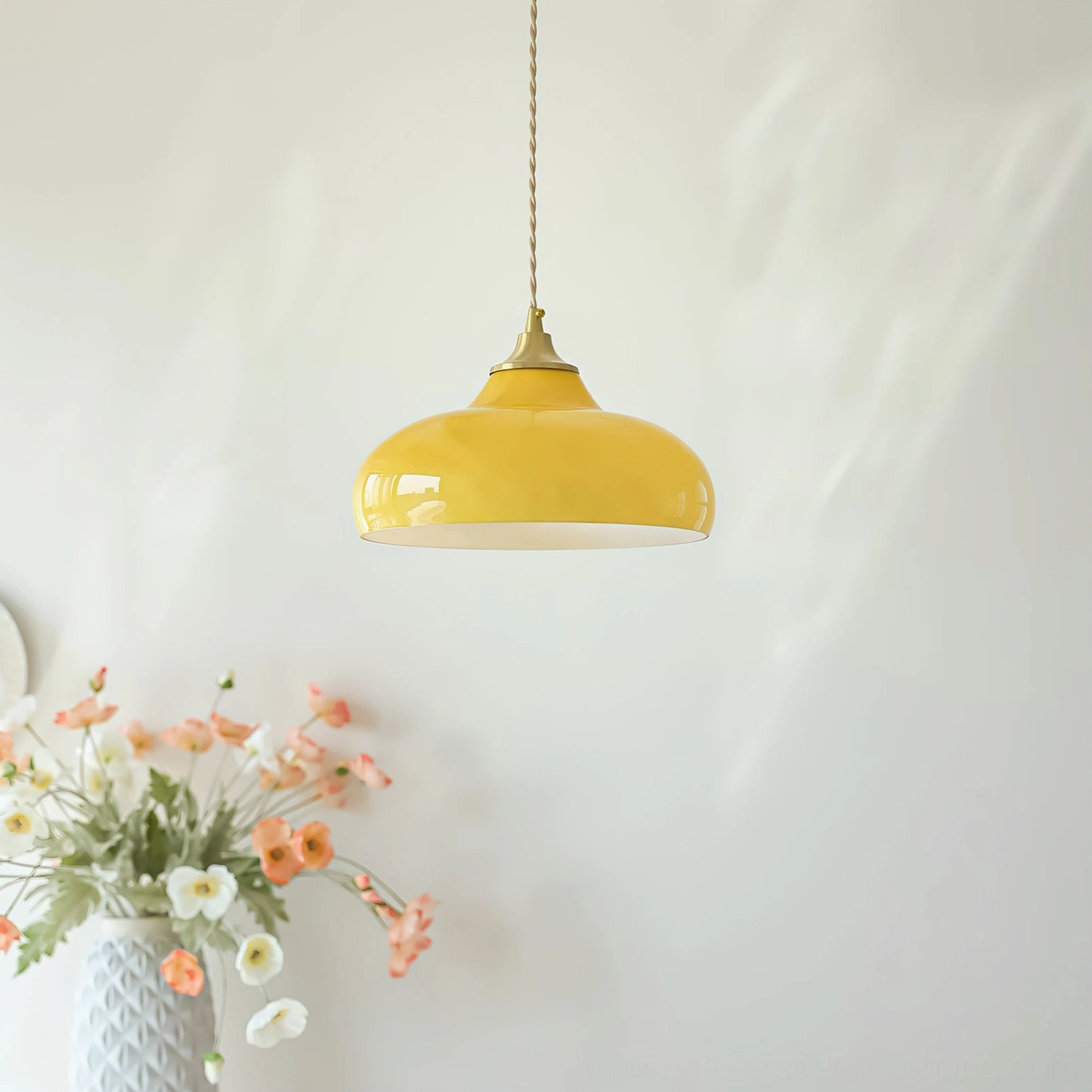 Citrine yellow dome pendant glowing warm in mid-century modern interior with floral decor and woven wall hanging