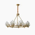 Clara Crystal Chandelier overhead view with waterdrop crystal ornaments on pure white background, showcasing full brass frame and prismatic crystal design