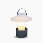 Claro cordless outdoor table lamp with frosted acrylic shade and aluminum base, front studio view