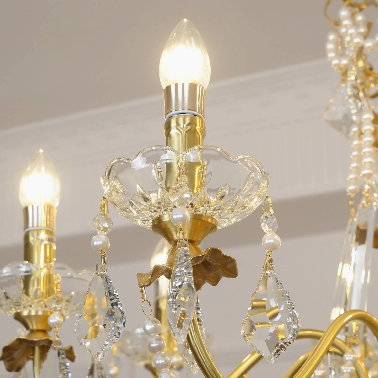 Classic brass crystal chandelier with 8 candle-style lamp holders and faceted crystal pendants