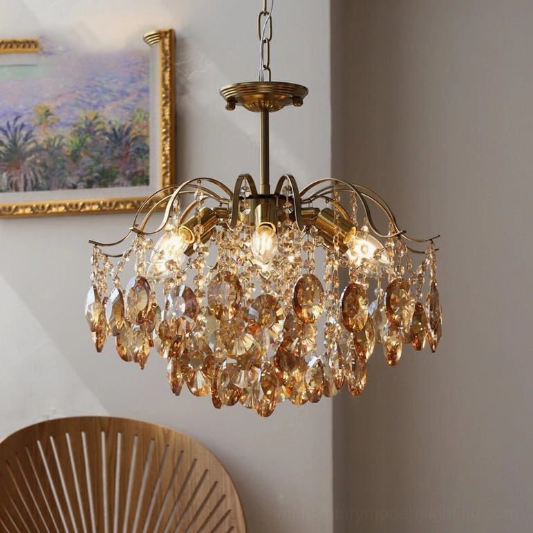 Clear crystal chandelier medium size with brass frame and multiple transparent crystal pendants in decorator space