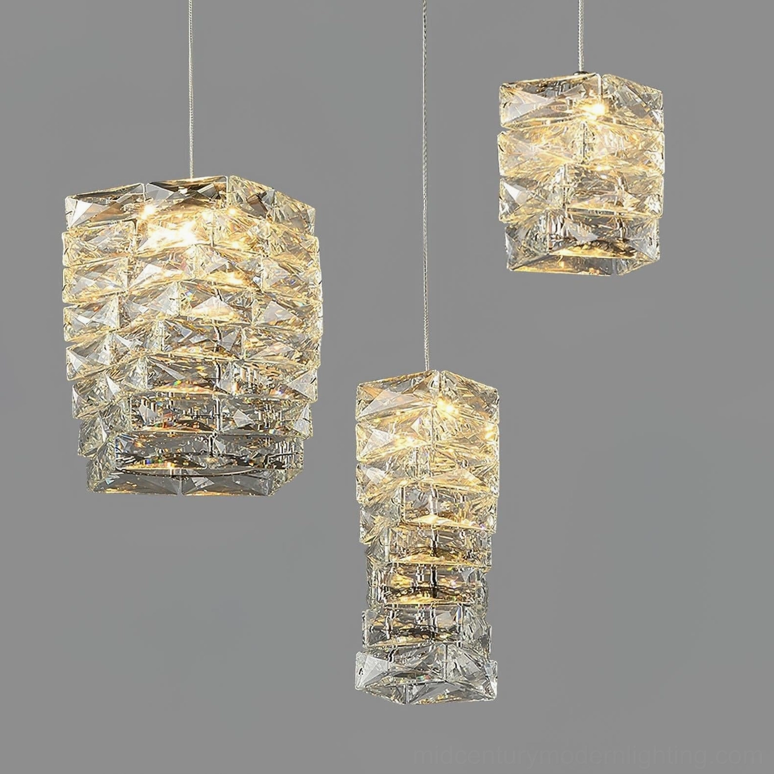 Clear faceted crystal pendant lamp suspended in interior space with minimalist contemporary styling