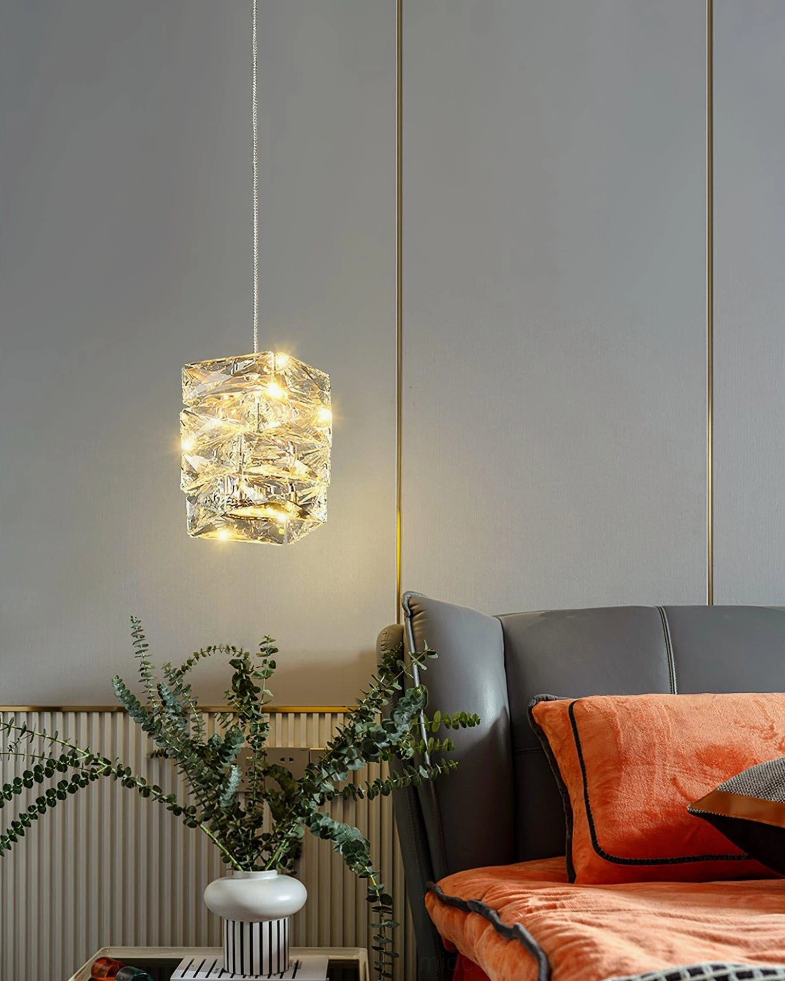 Clear crystal faceted pendant suspended in modern space showing versatile sizing and contemporary design
