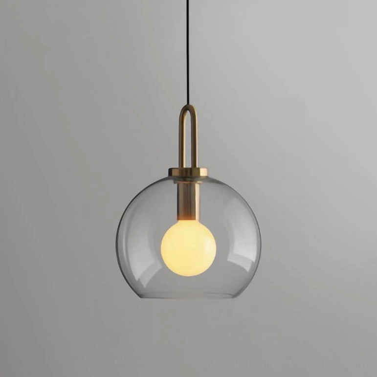 Clear glass medium spherical smoked pendant showing transparent luminous quality in dining nook