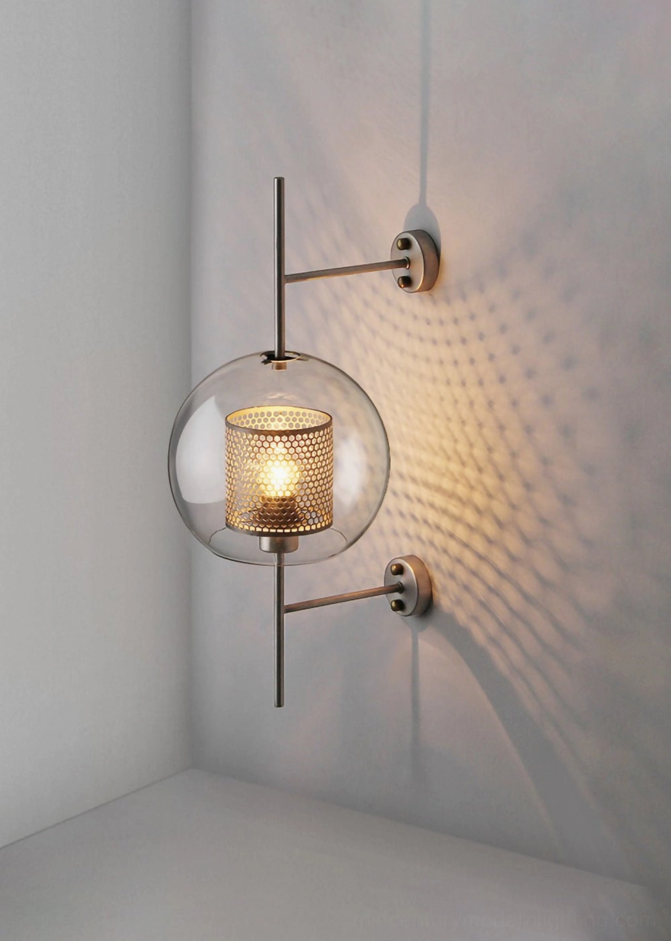 Contemporary glass wall lamp with clear glass and polished metal finish
