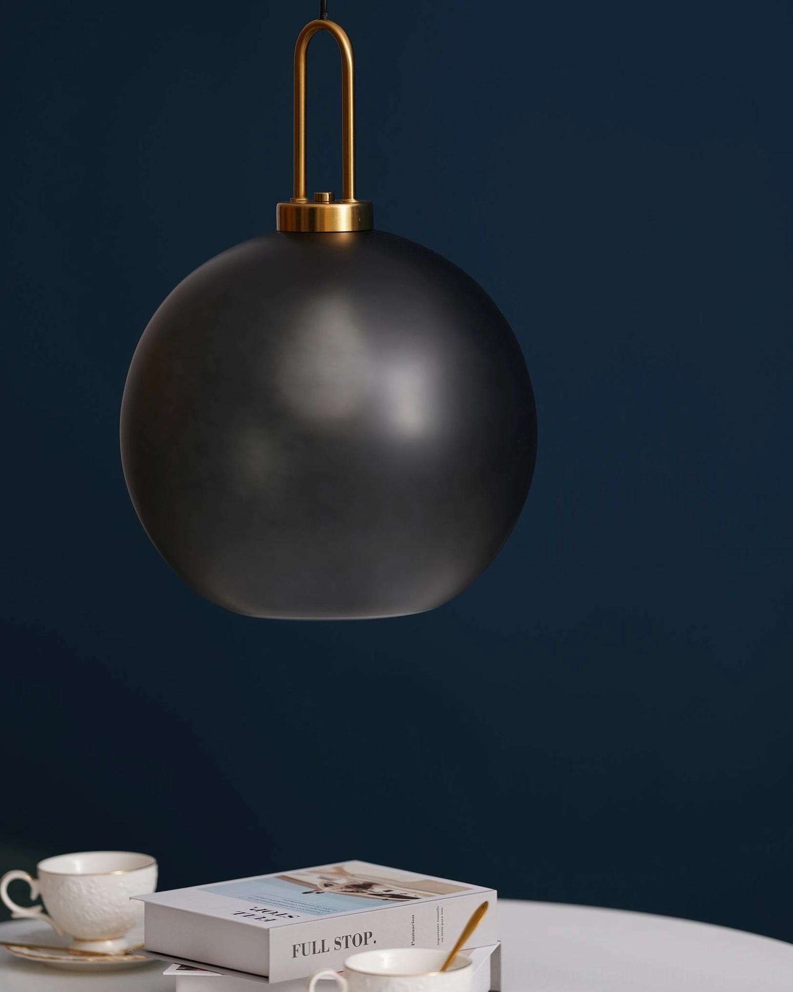 Clear glass spherical smoked glass pendant lamp creating transparent luminous effect in modern space