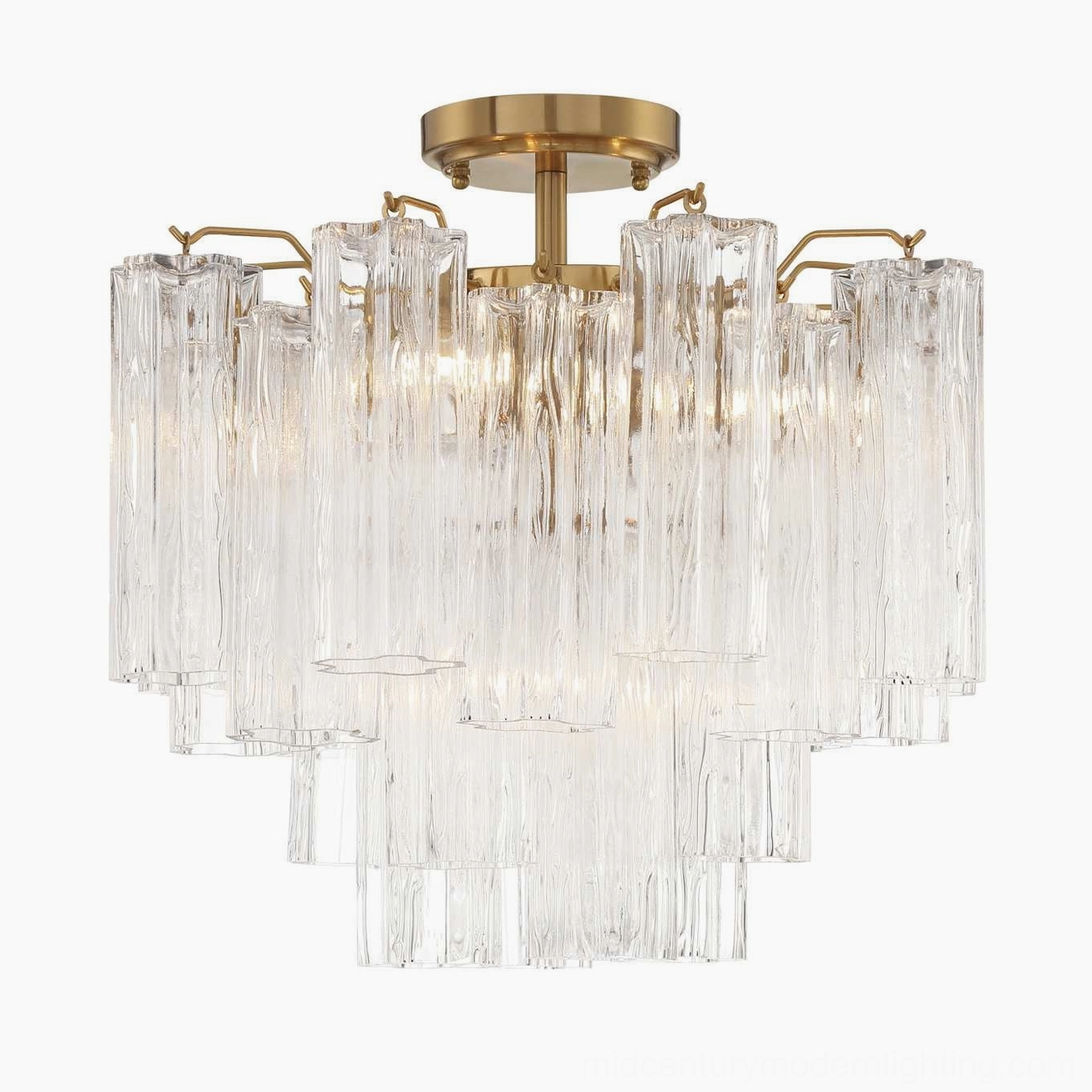 Illuminated clear Murano tubular chandelier with bright light transmission through ribbed glass and brass mounting