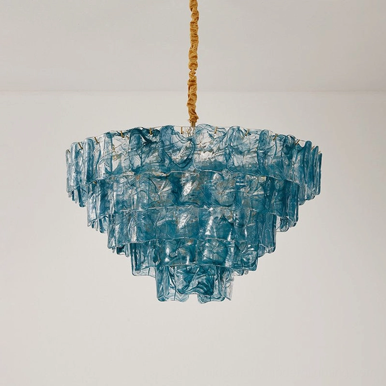 Symmetrical three-tier blue marbled glass chandelier with brass hardware, front hanging studio view, sculptural pendant light design