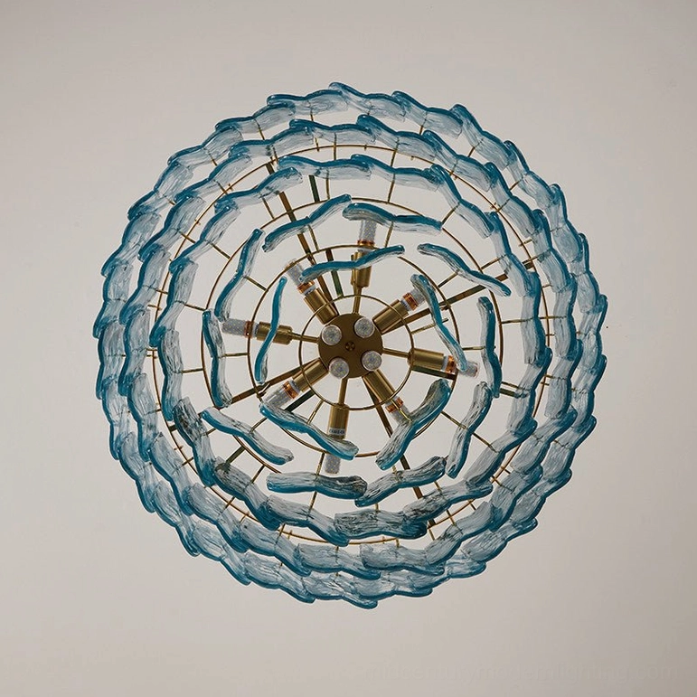 Bottom radial view of tiered glass chandelier showing brass metal frame structure and layered glass trim rings, geometric architectural design
