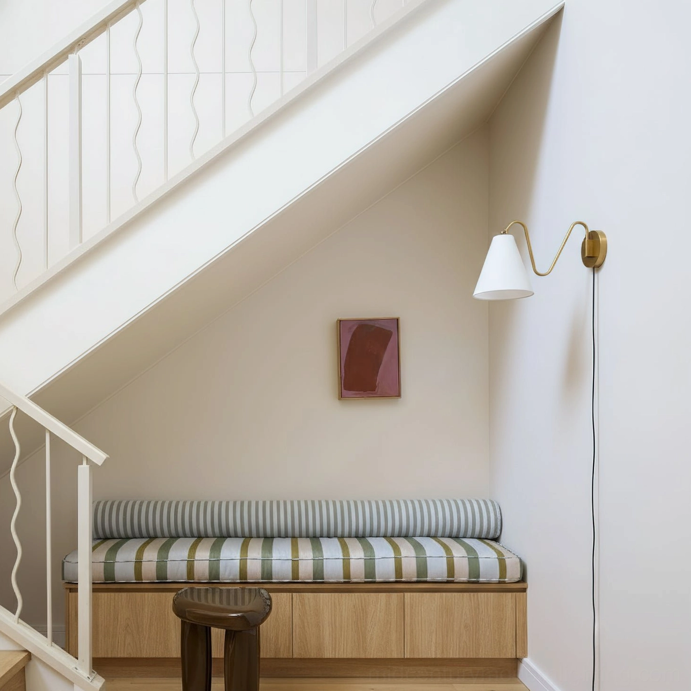 Minimalist swing arm wall lamp white shade brass hardware attic stair landing compact design