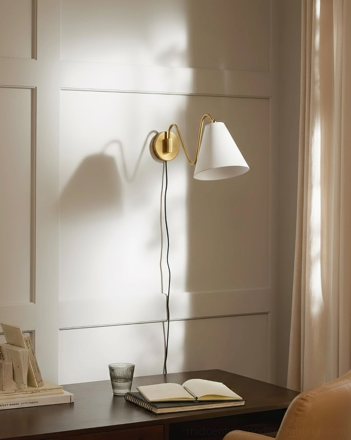 Brass swing arm wall sconce dining area nook wainscot paneling mid-century lighting
