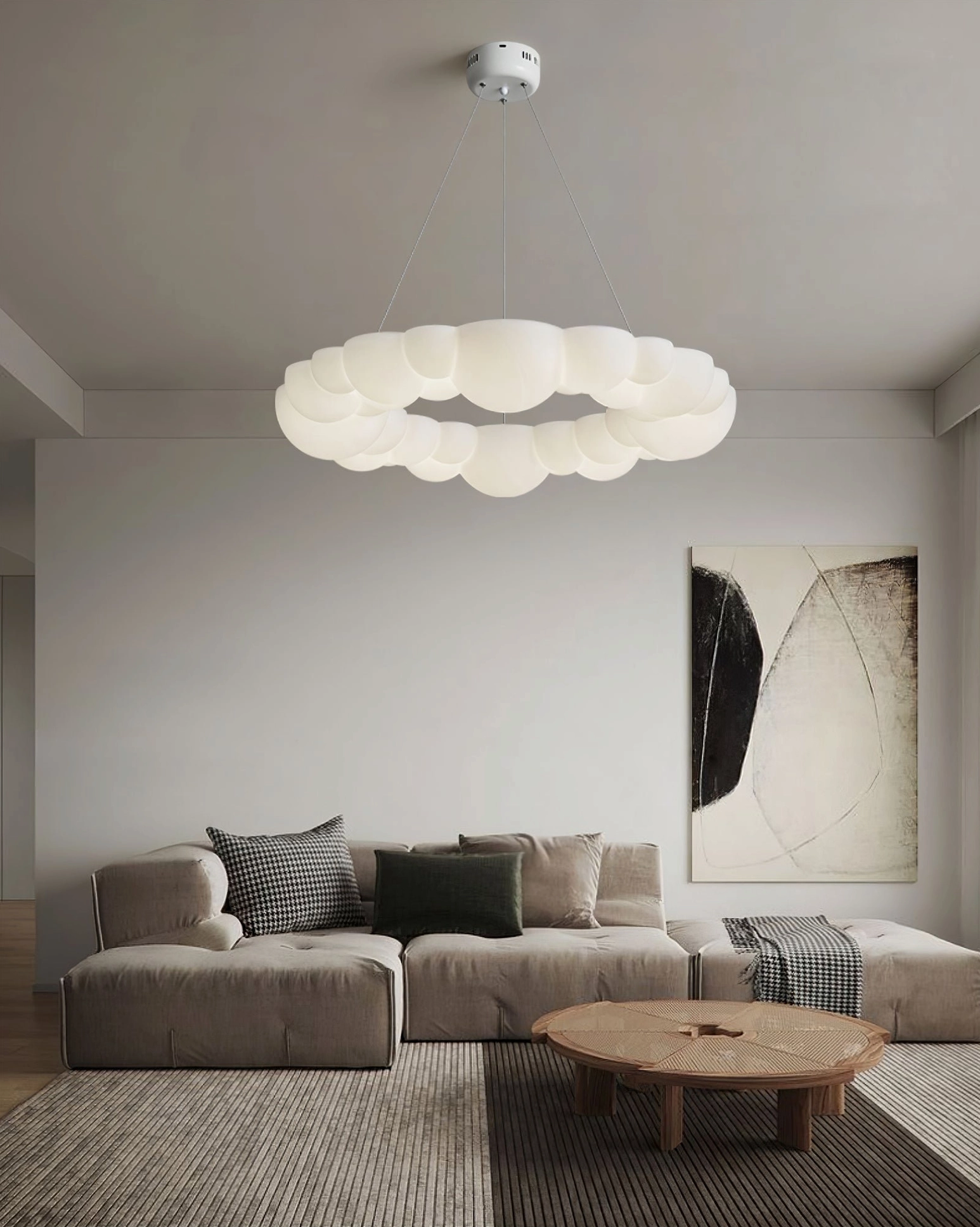 Modern Cloud Bubble Halo Ring Chandelier illuminated in contemporary living room with sectional sofa