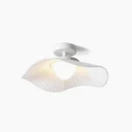 Cloud ceiling light with pleated white fabric shade, minimalist sculptural design on white background
