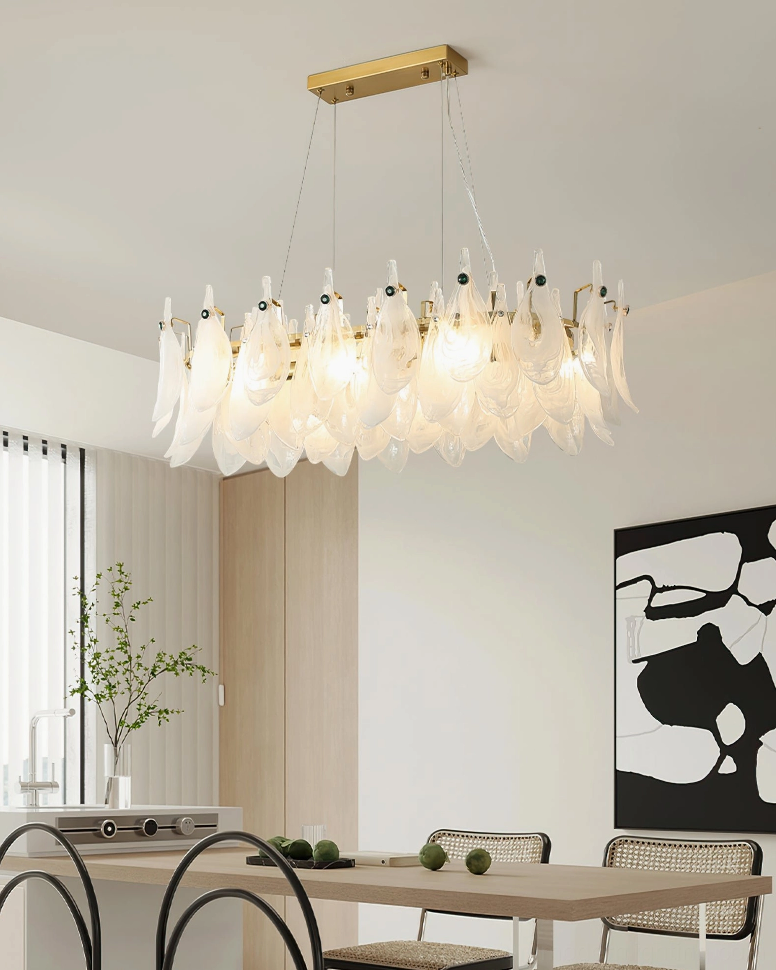 Cloud glass chandelier with warm ambient lighting above modern dining table