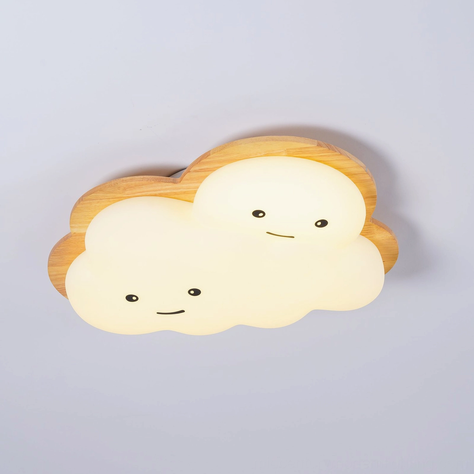 Smiling cloud ceiling lamp design detail showing wood and acrylic construction with cheerful expression