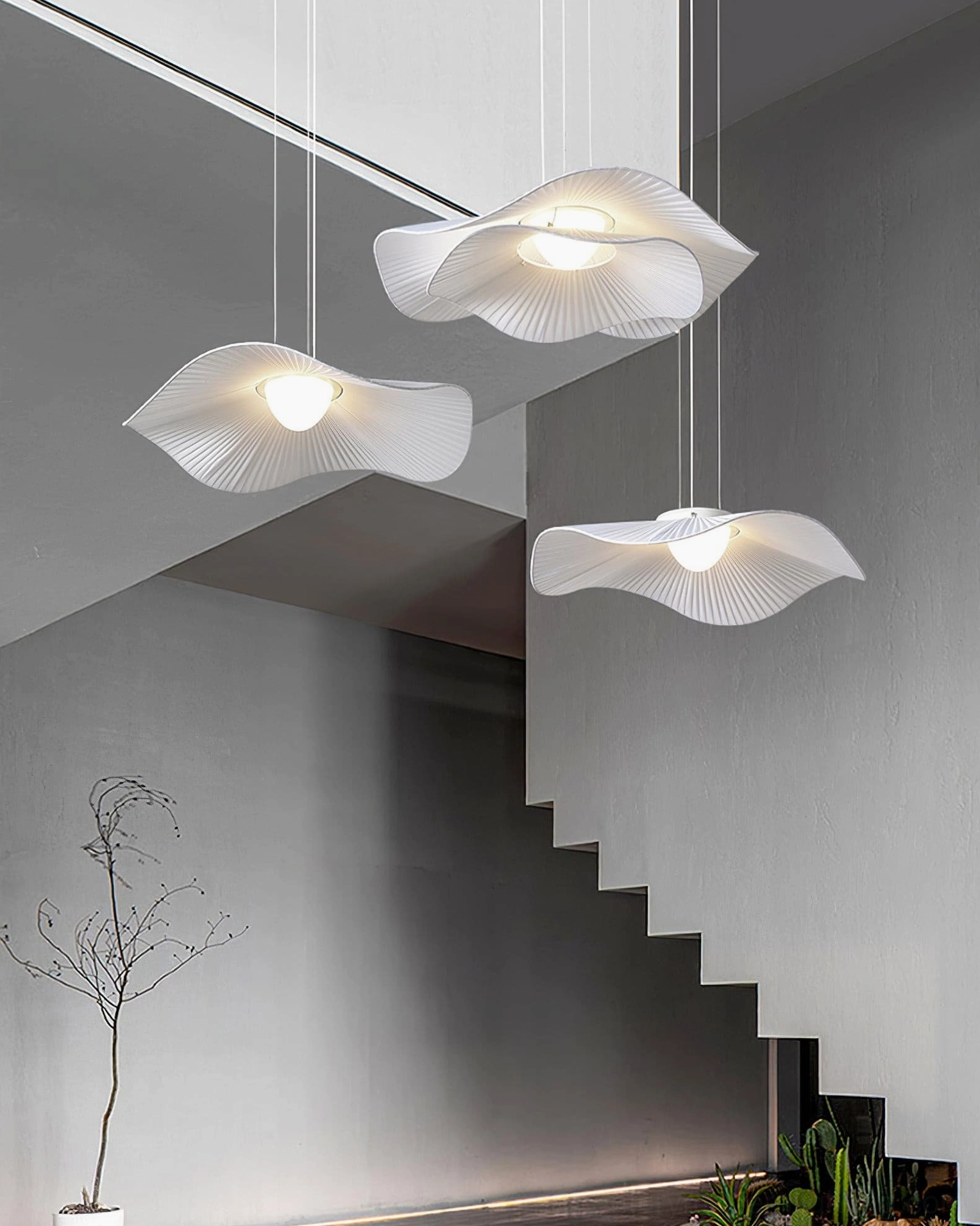 Cloud pendant lamp lighting effect warm ambient glow through pleated white fabric layers