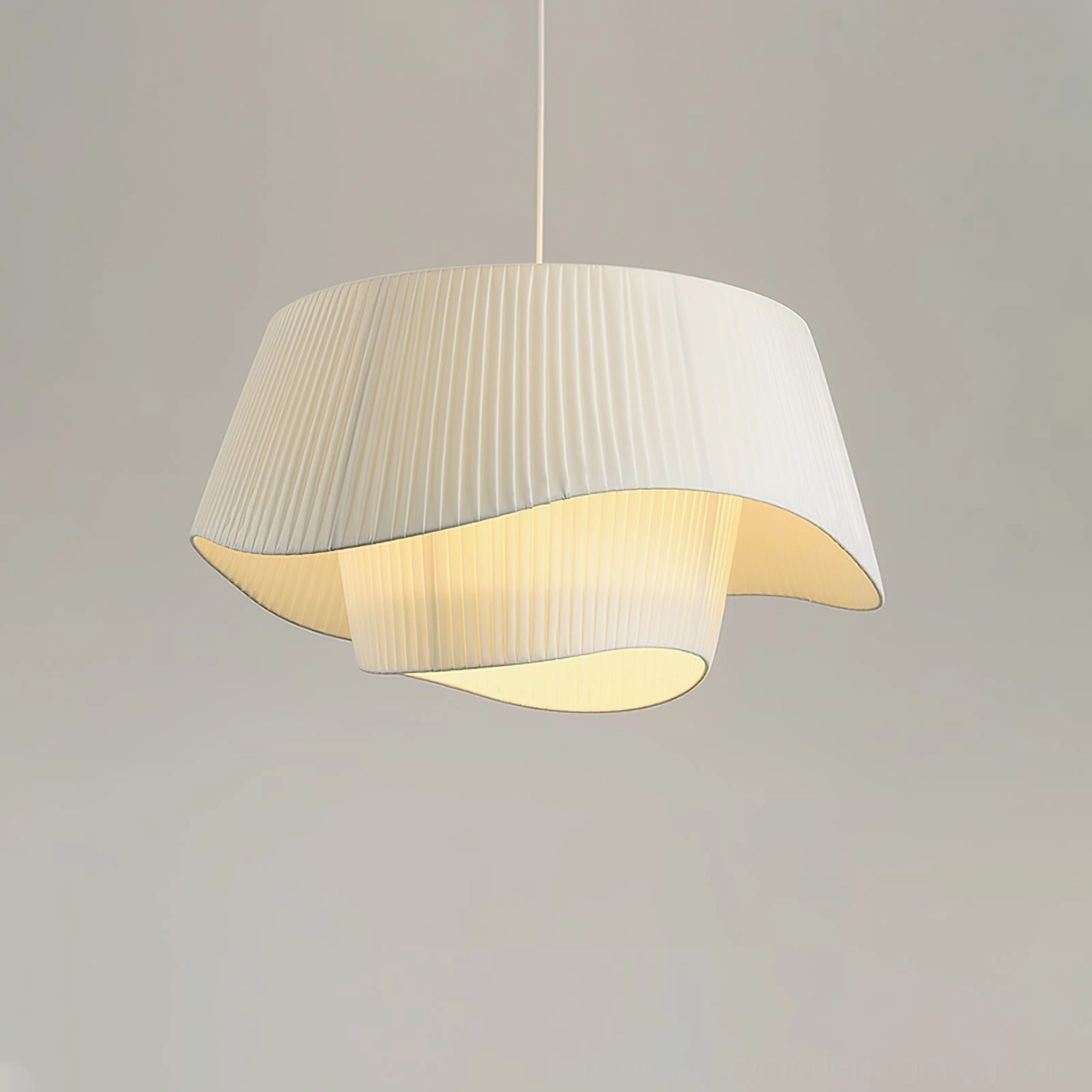 Coco pleated pendant lamp with LED bulb illuminated showing soft light diffusion through pleats
