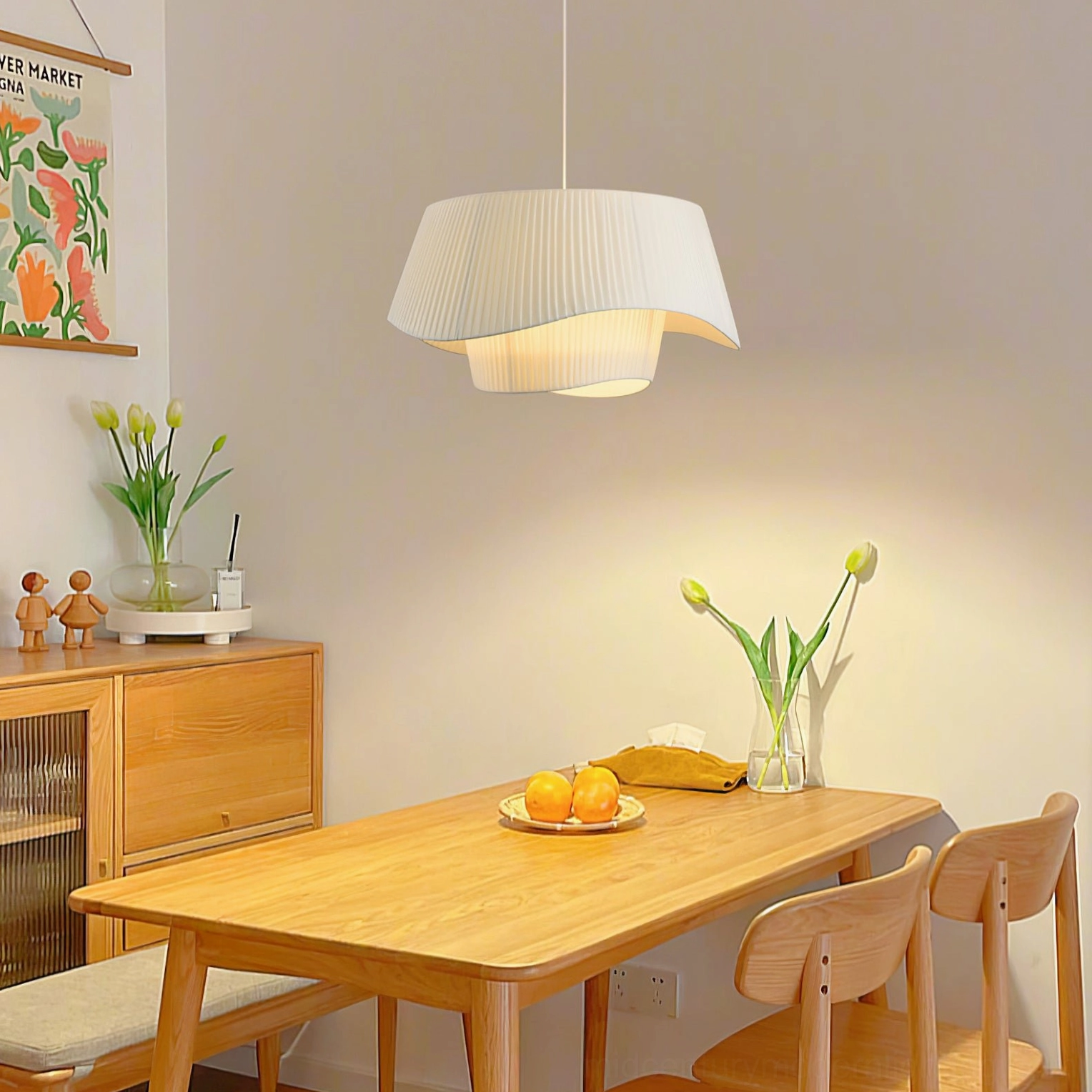 Coco pleated fabric pendant lamp with fresh flower arrangement in minimalist dining nook