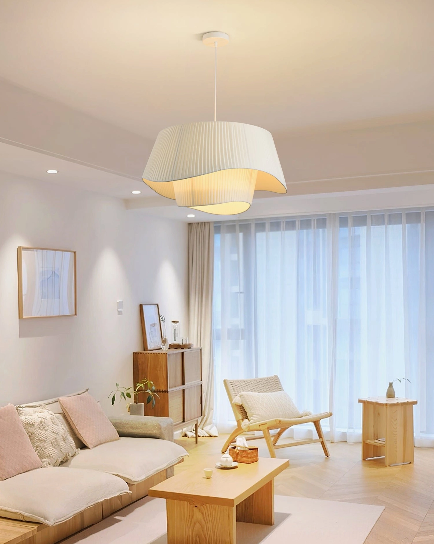Coco pleated pendant lamp side profile highlighting sculptural undulating shade design