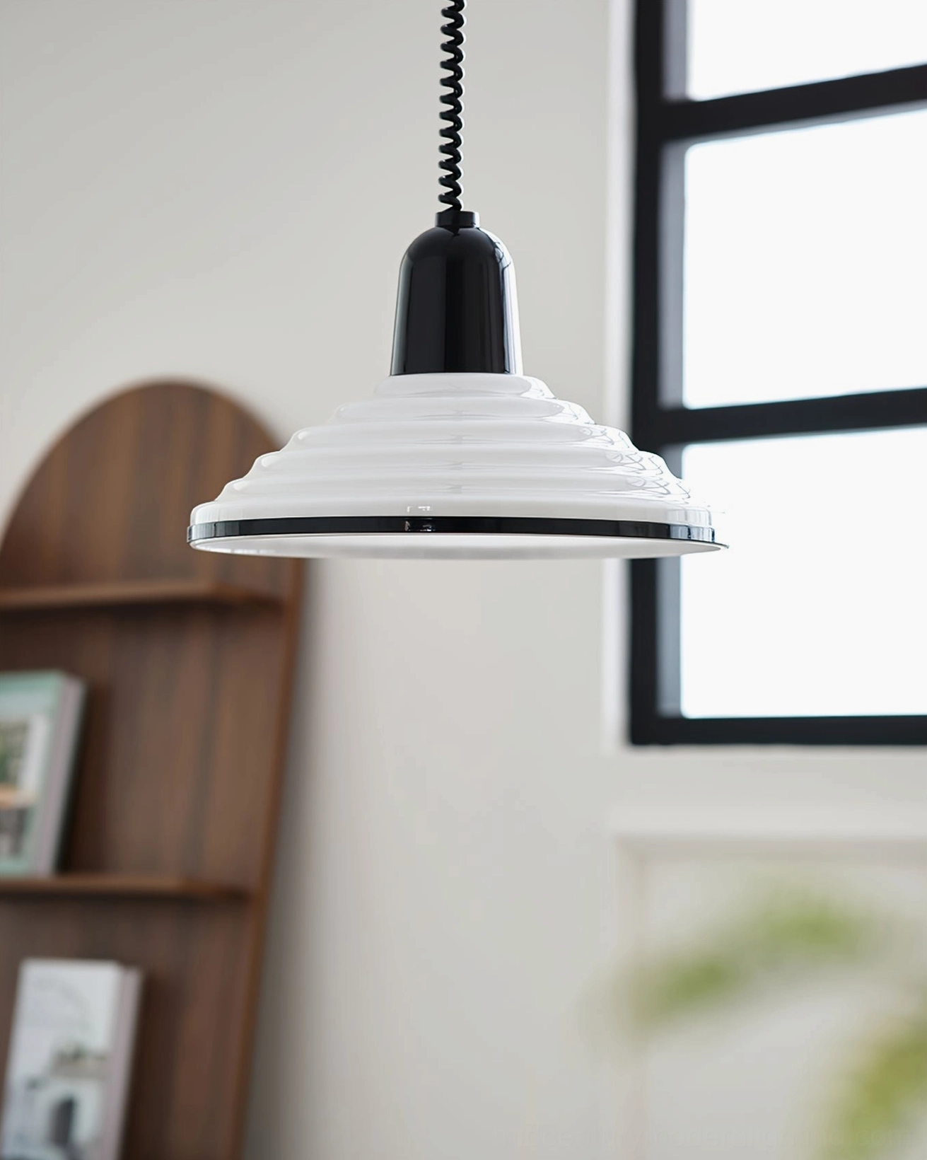 Black and white modern pendant lamp displayed above wooden shelf minimalist home decor