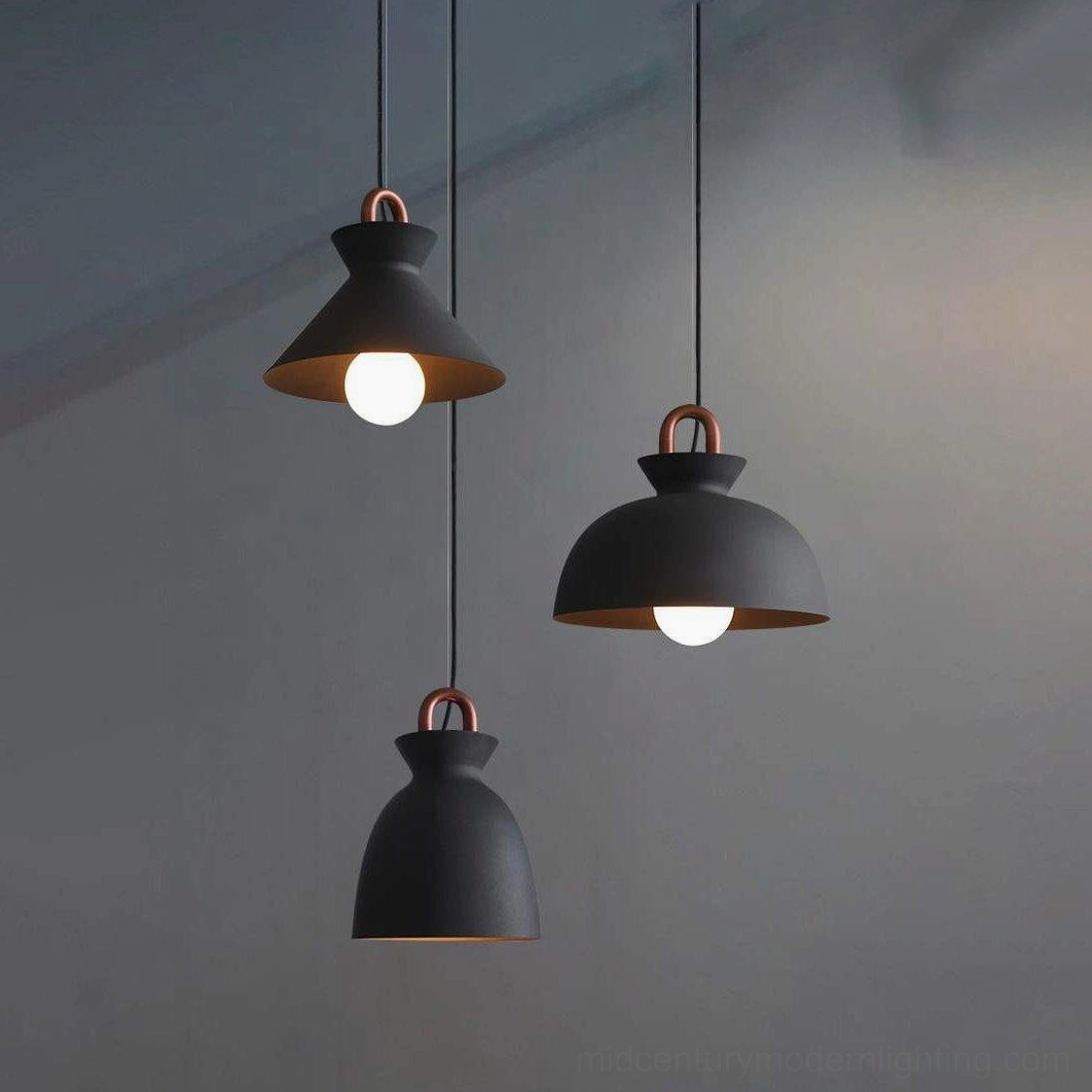 Black coil pendant light creating intimate lighting effect in cozy home interior
