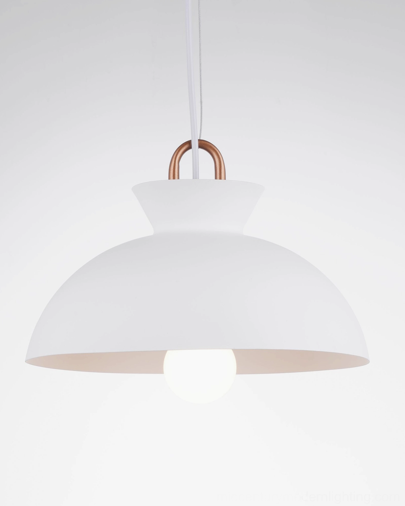 Black coil pendant light fixture showing premium metal construction and finish quality