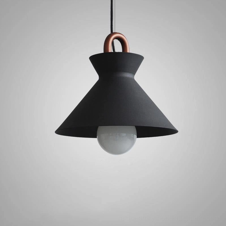 Black matte coil pendant light showcasing modern minimalist design philosophy
