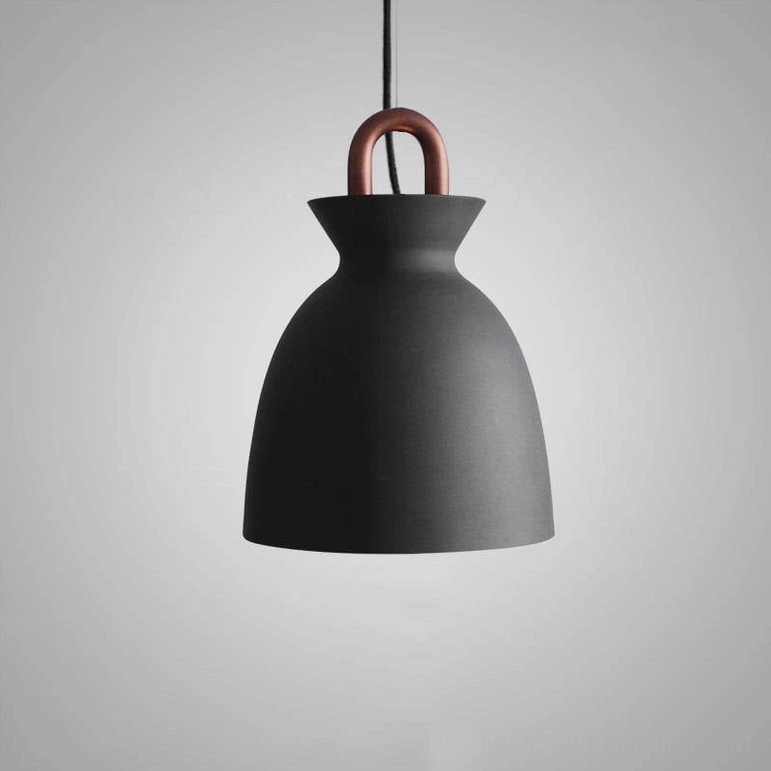 Black coil suspension pendant light in scandinavian modern interior setting
