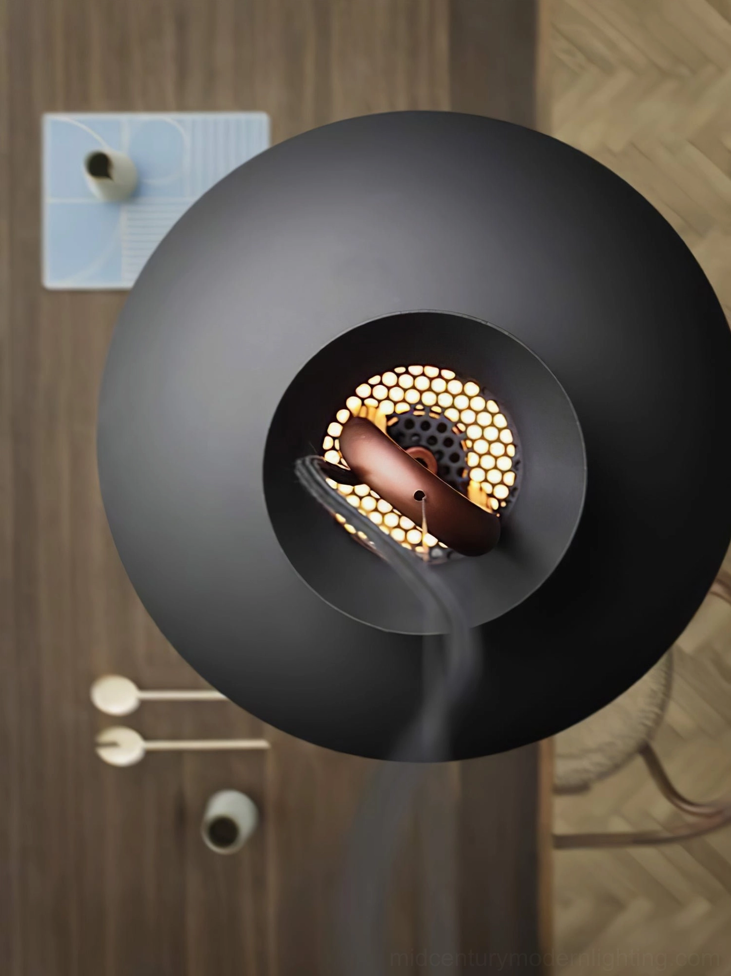 Coil modern pendant lamp installed in contemporary entryway making design statement