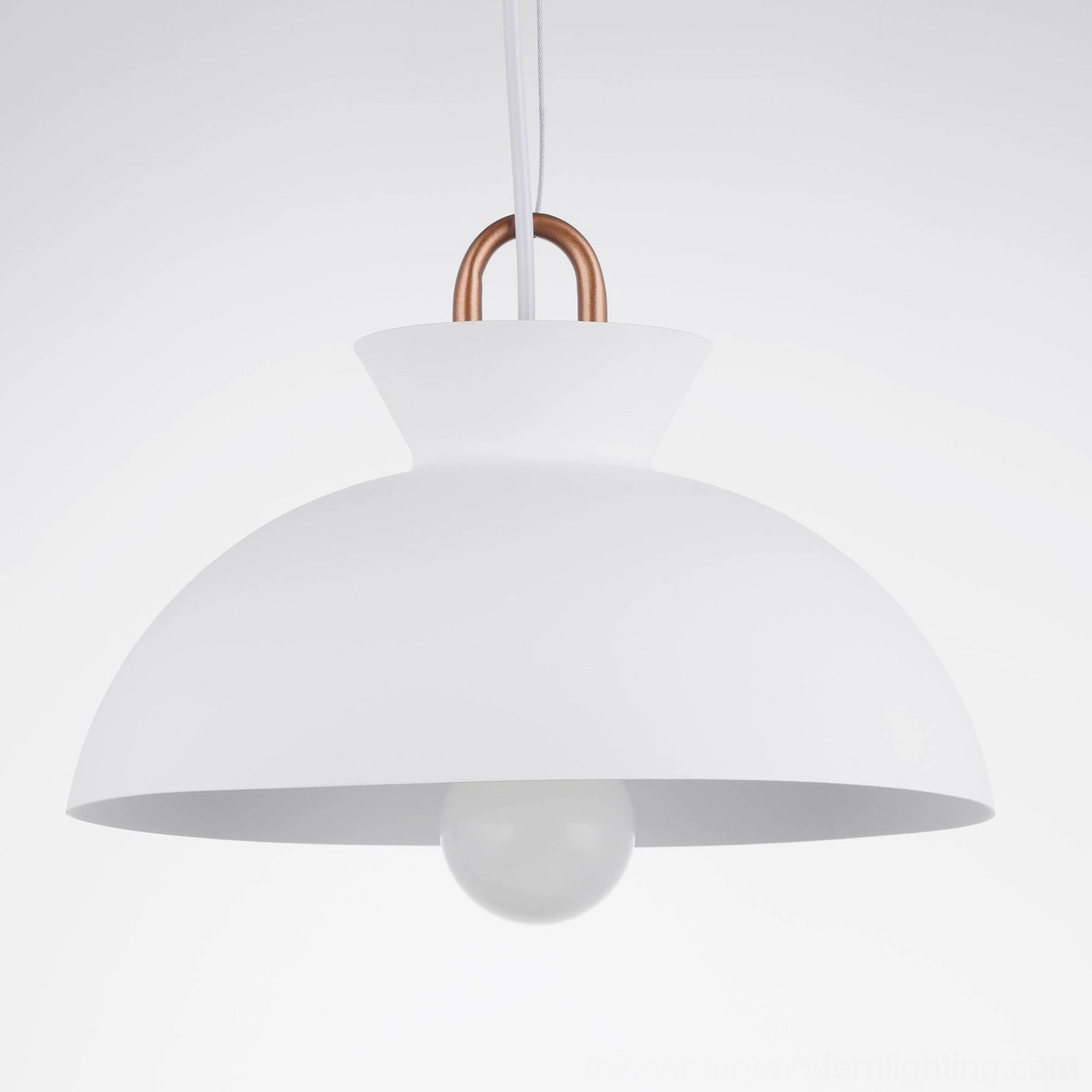 Coil modern pendant light installation over kitchen island in minimalist kitchen