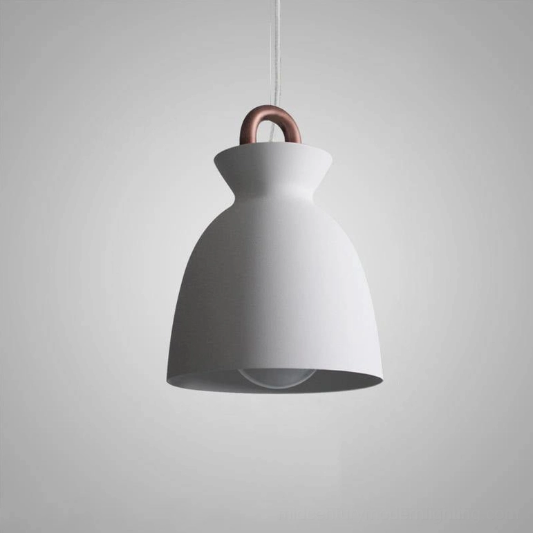 White coil pendant lamp with exposed bulb creating contemporary visual interest