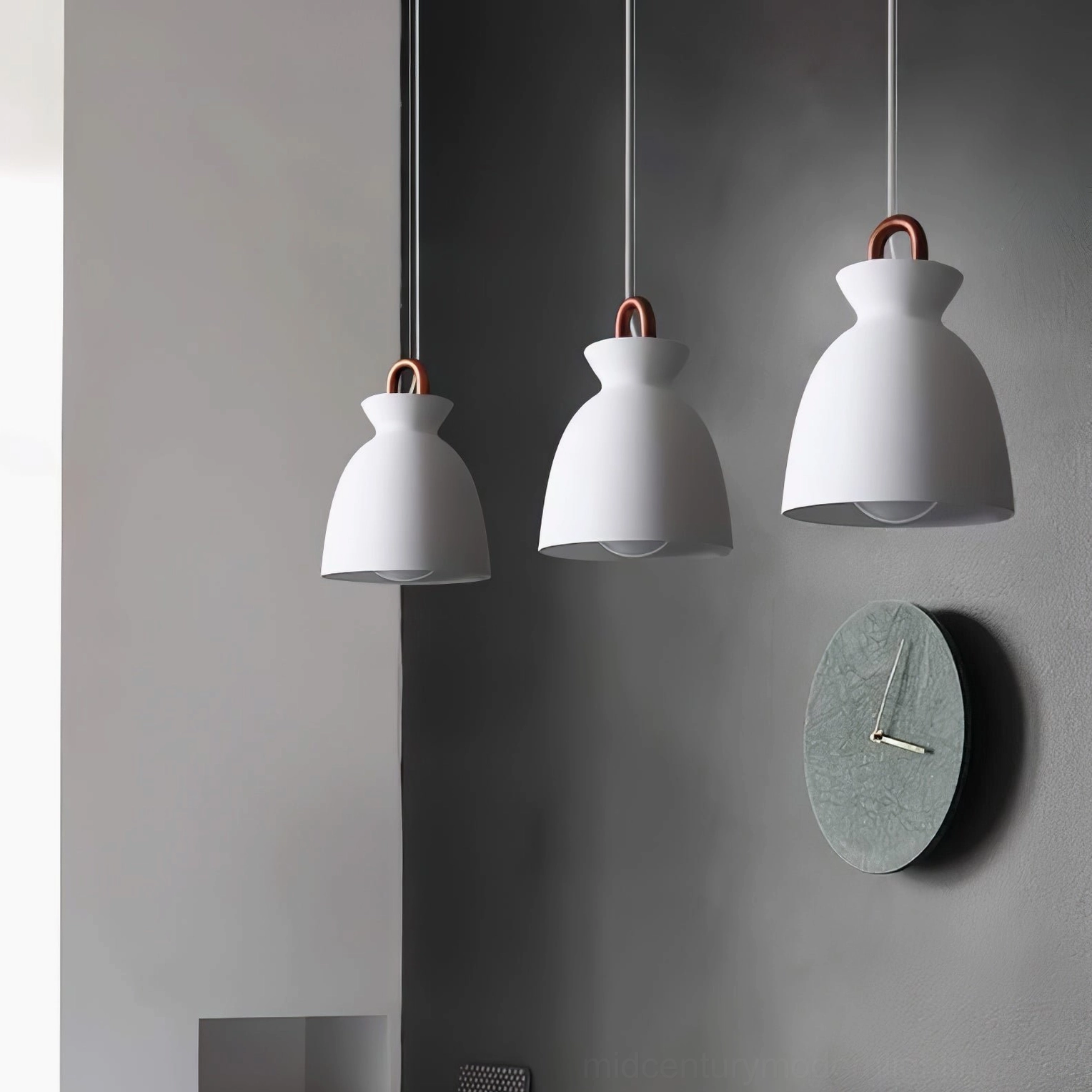 Set of three white bell-shaped coil pendant lights with uniform copper hooks