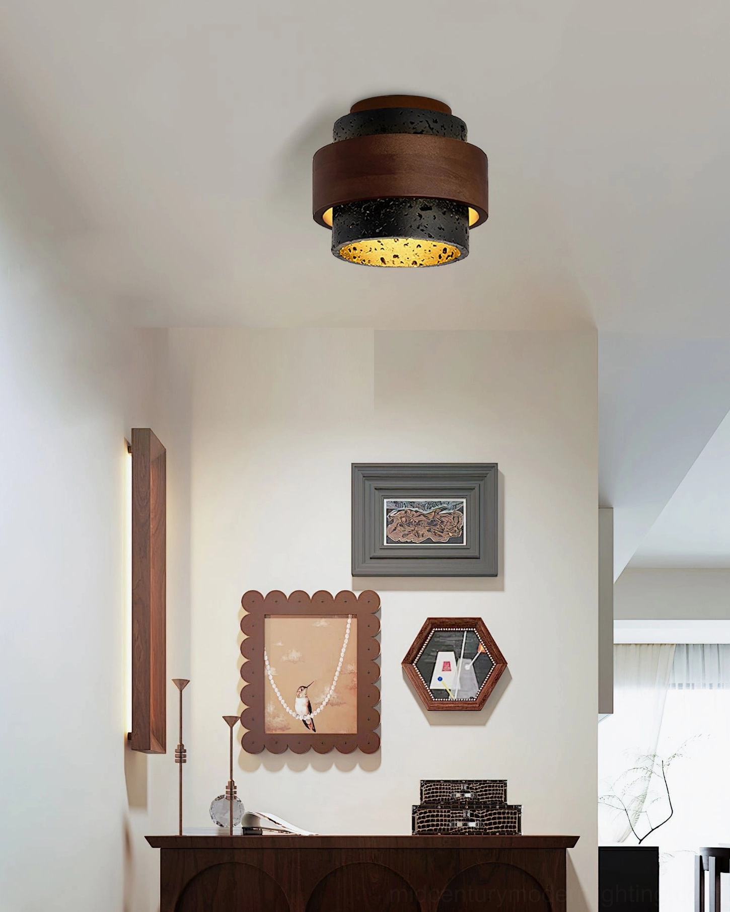 Cole Travertine ceiling light paired with decorative wall art and console table in residential hallway