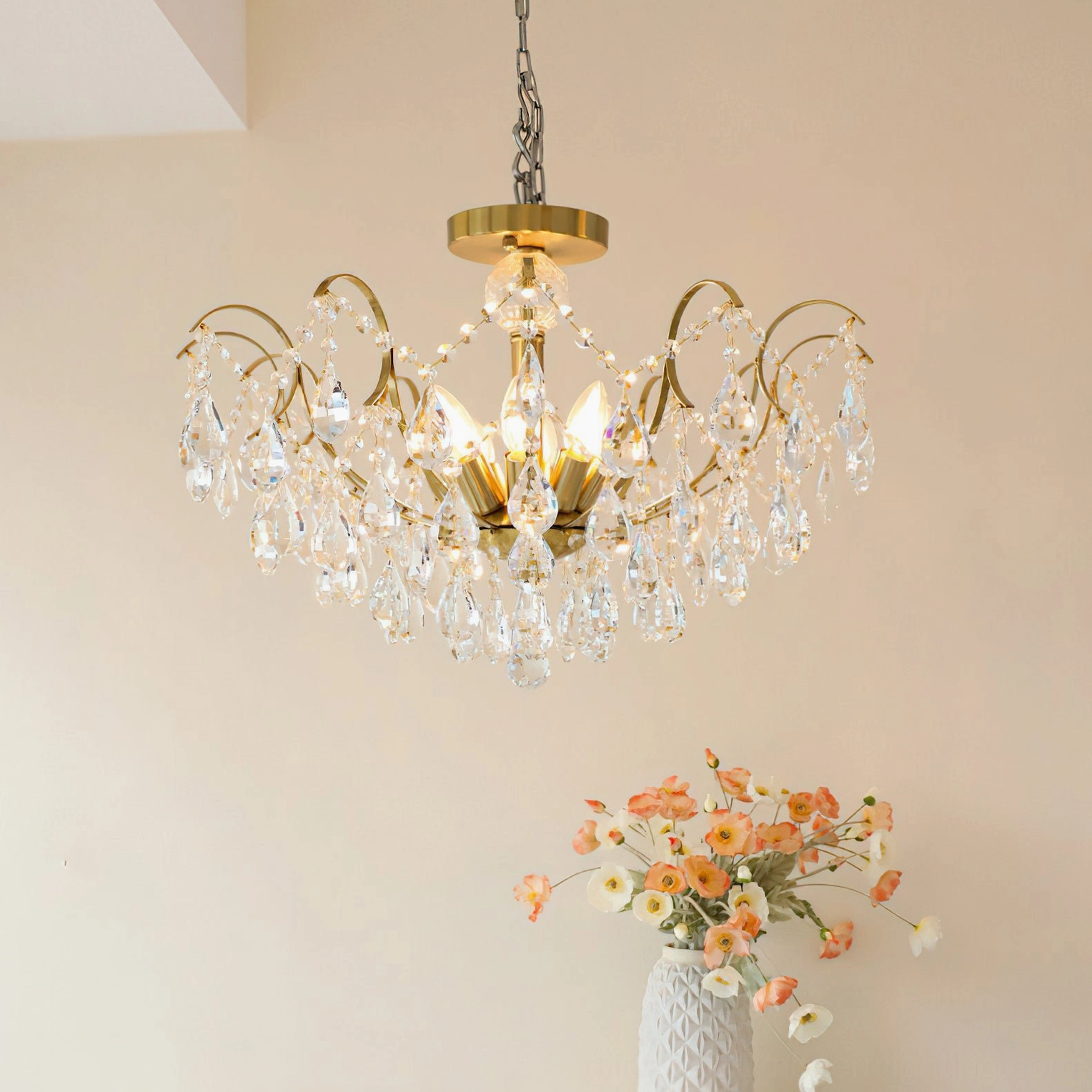 Colette Crystal Chandelier with warm lighting and crystal prism details in elegant interior setting