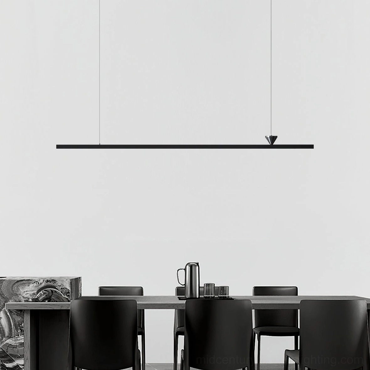 Modern black linear pendant chandelier above dining table in contemporary dining room
