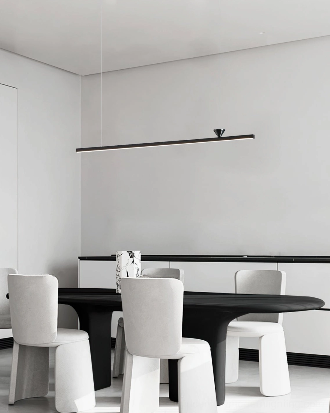 Black linear LED chandelier over dark round dining table and white chairs