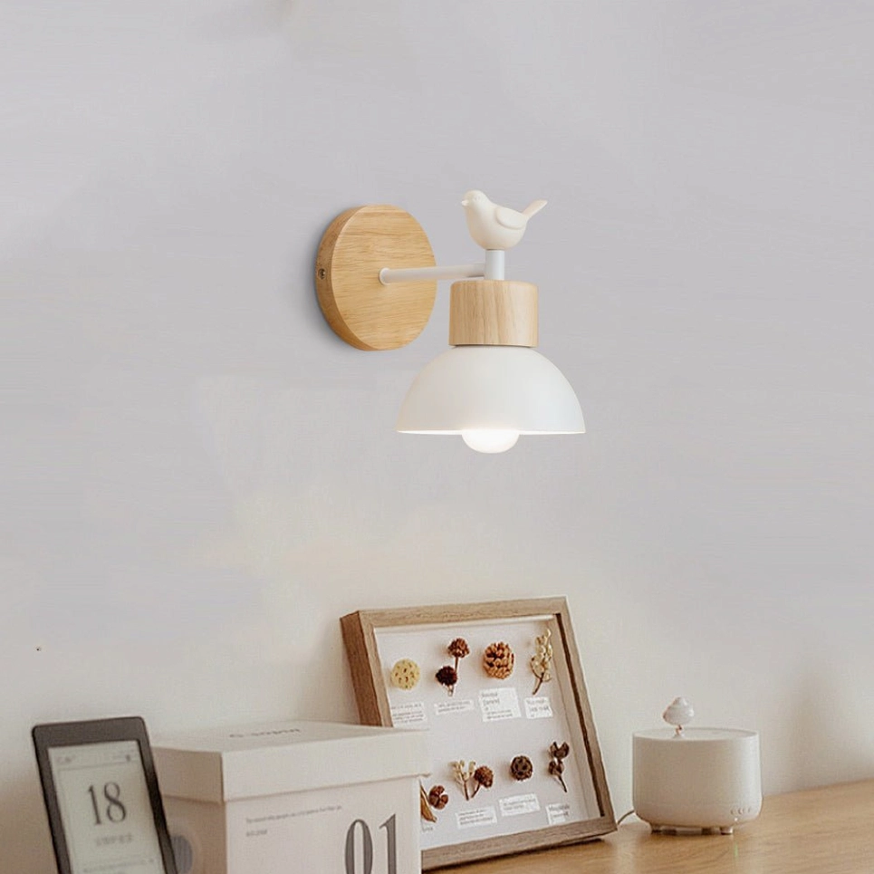 Colorato wall sconce displayed above console table with frames, warm home decor arrangement