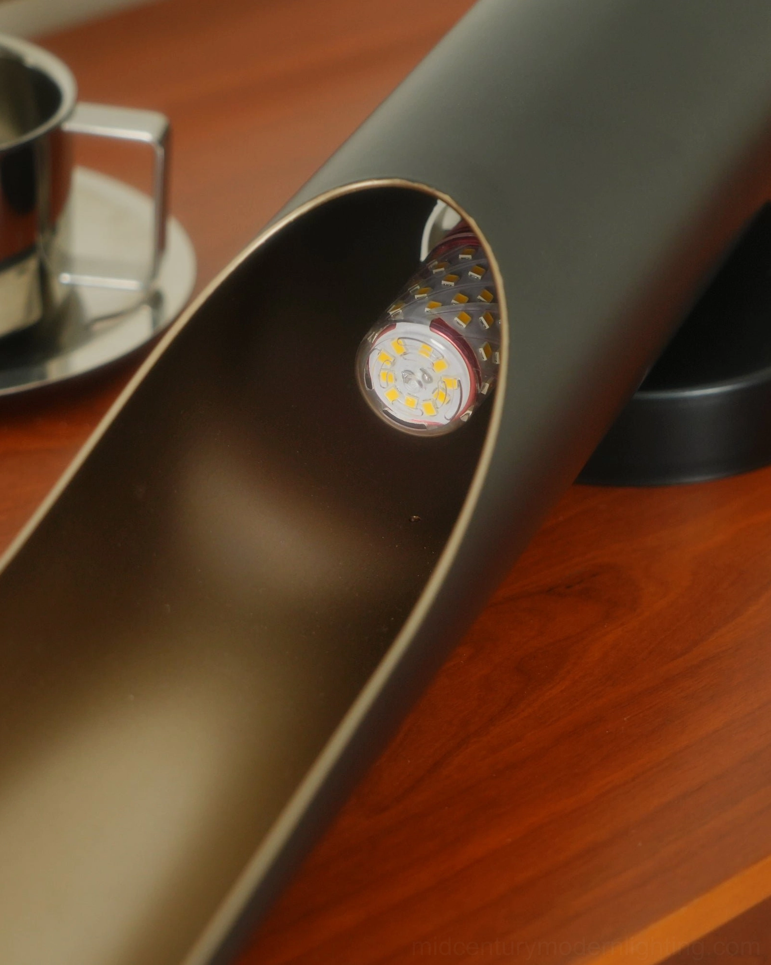 Coltrane wall lamp interior detail installed LED bulb bronze inner coating close-up