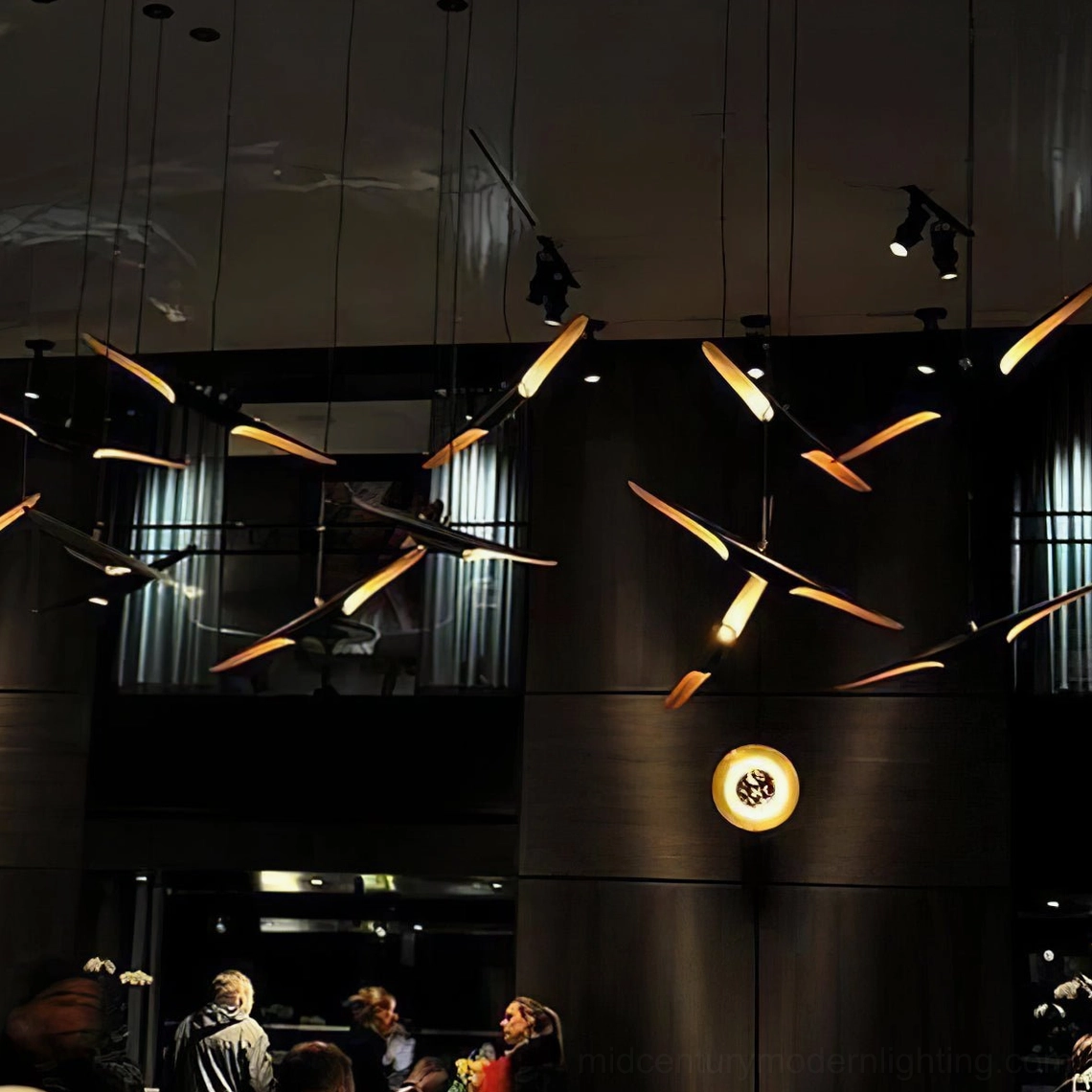 Coltrane modern linear pendant lamp showing dual-tone black and gold design aesthetic