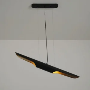 Modern linear pendant lamp in matte black with warm gold interior glow, three-quarter side angle