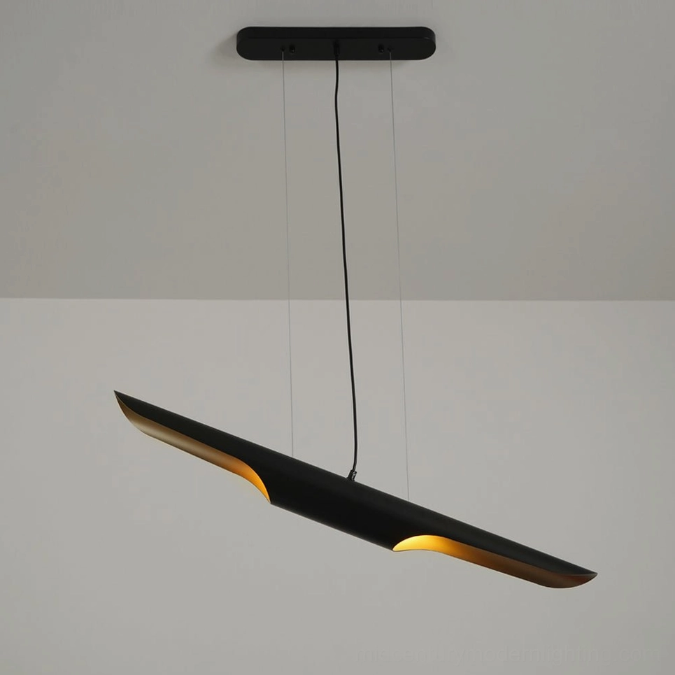 Modern linear pendant lamp in matte black with warm gold interior glow, three-quarter side angle