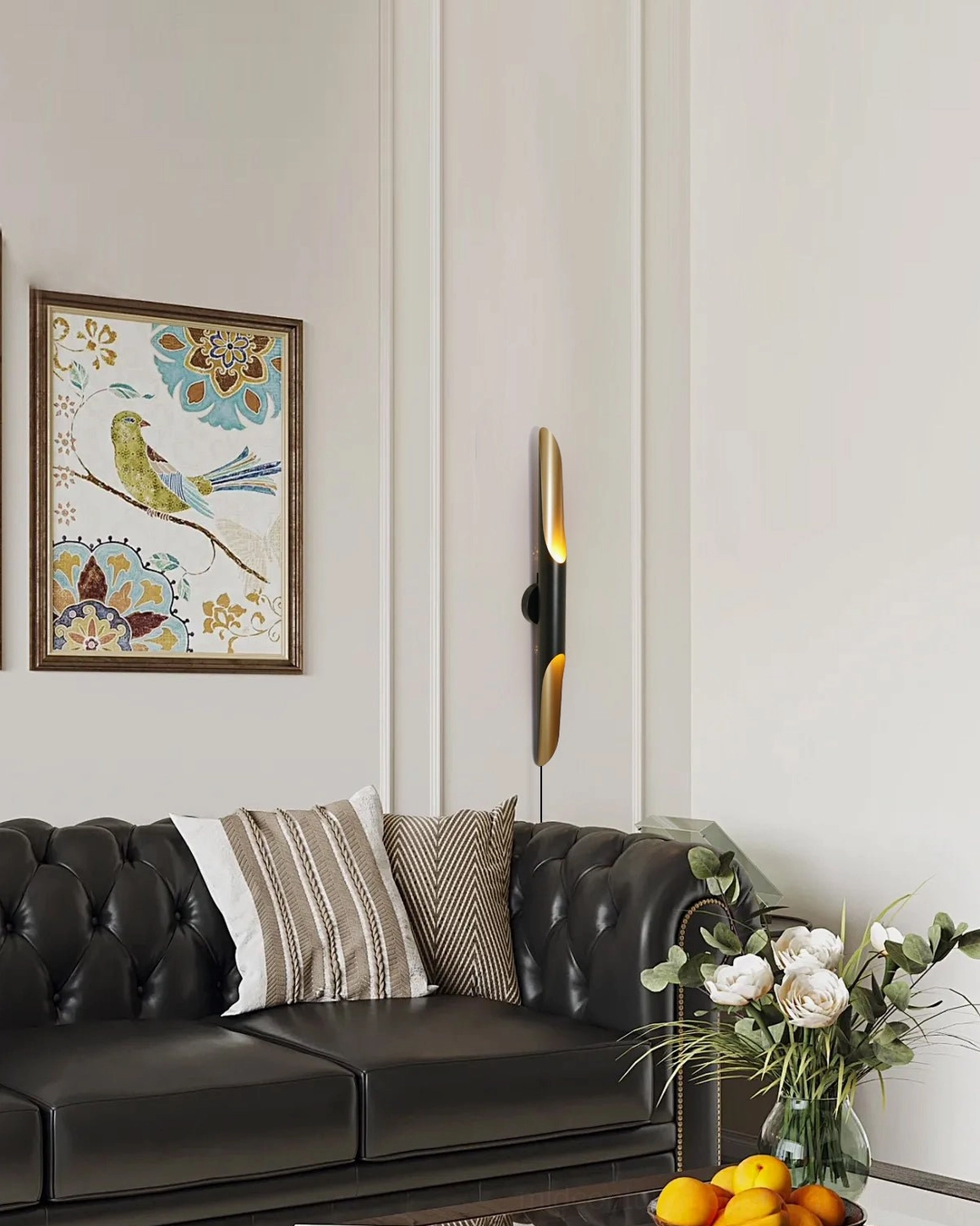 Single Coltrane wall sconce in modern living room above black leather sofa