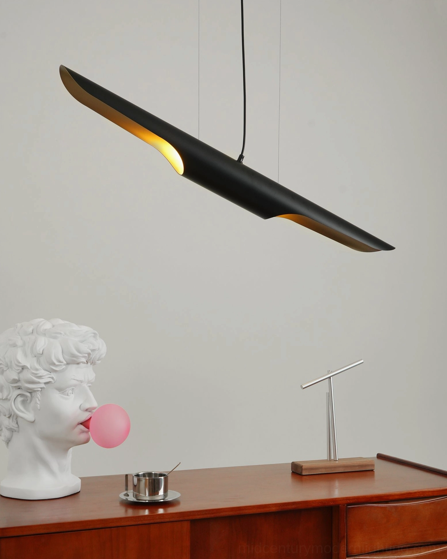 Coltrane suspension pendant light showing compact linear silhouette and adjustable design