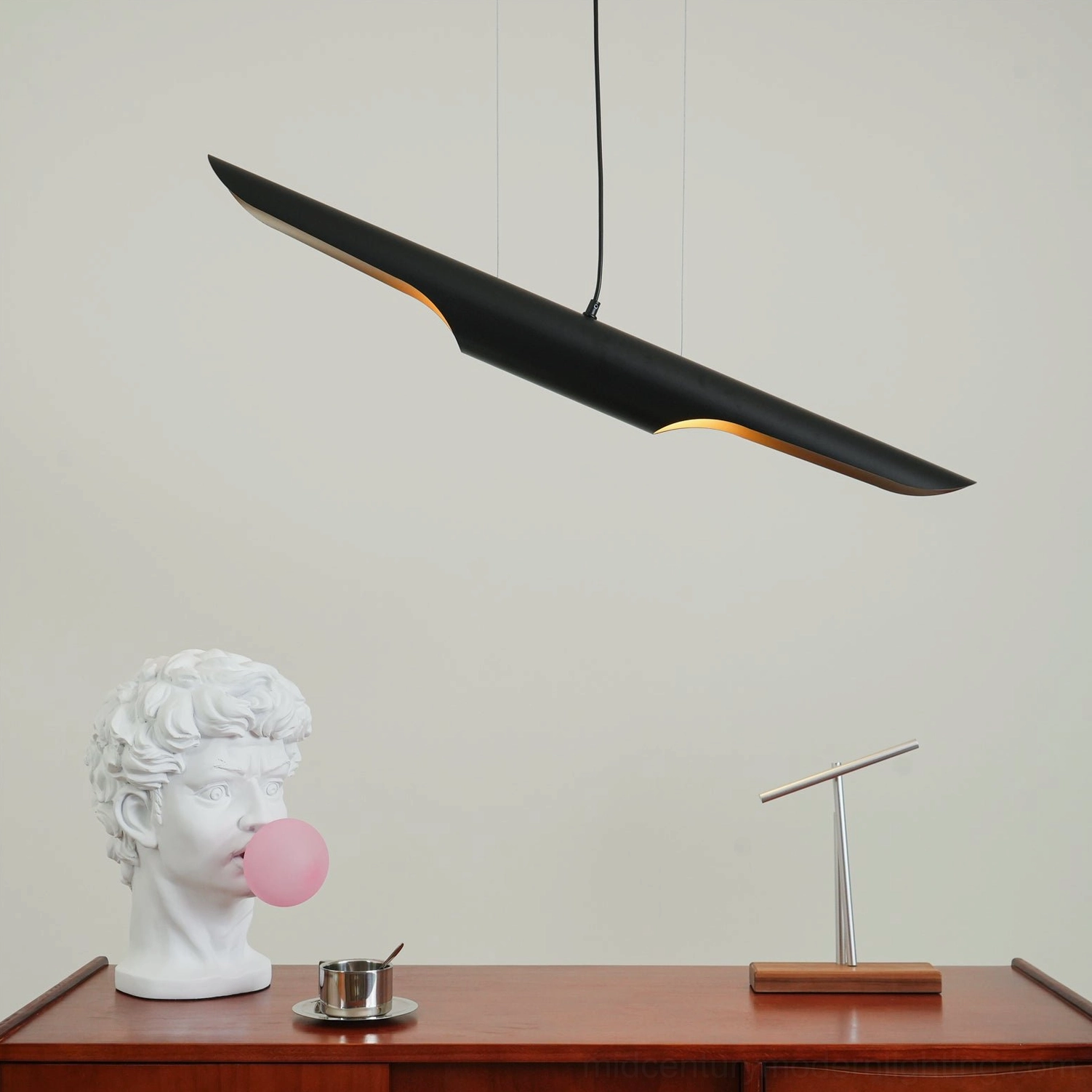 Coltrane linear pendant light in modern interior setting with minimalist aesthetic styling