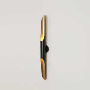 Coltrane minimalist wall sconce three-quarter angle view showing matte black finish and bronze interior