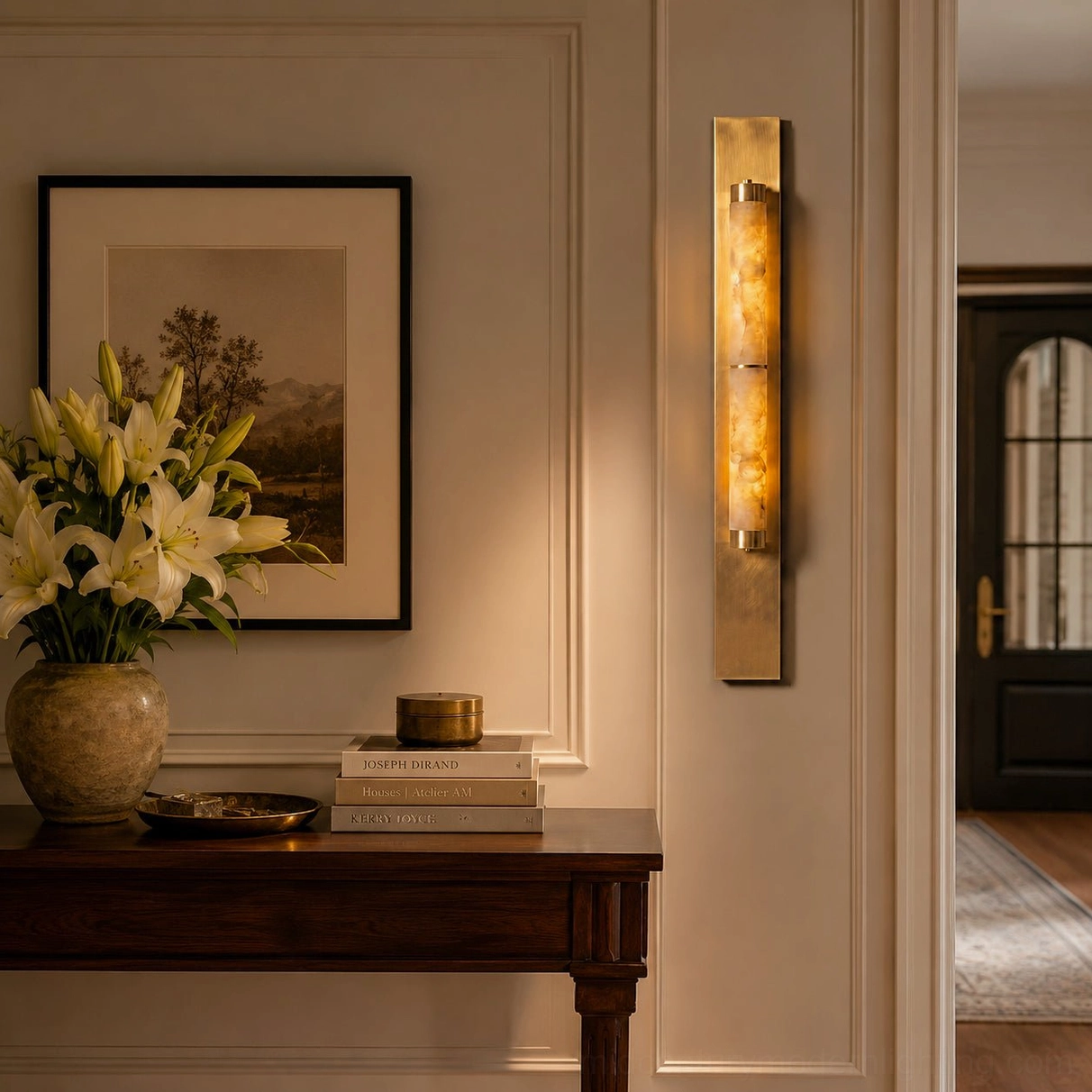 Modern columnar alabaster wall sconce detail shot showing stone texture and brass mounting