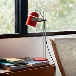 Red adjustable table lamp by window minimalist desk lighting