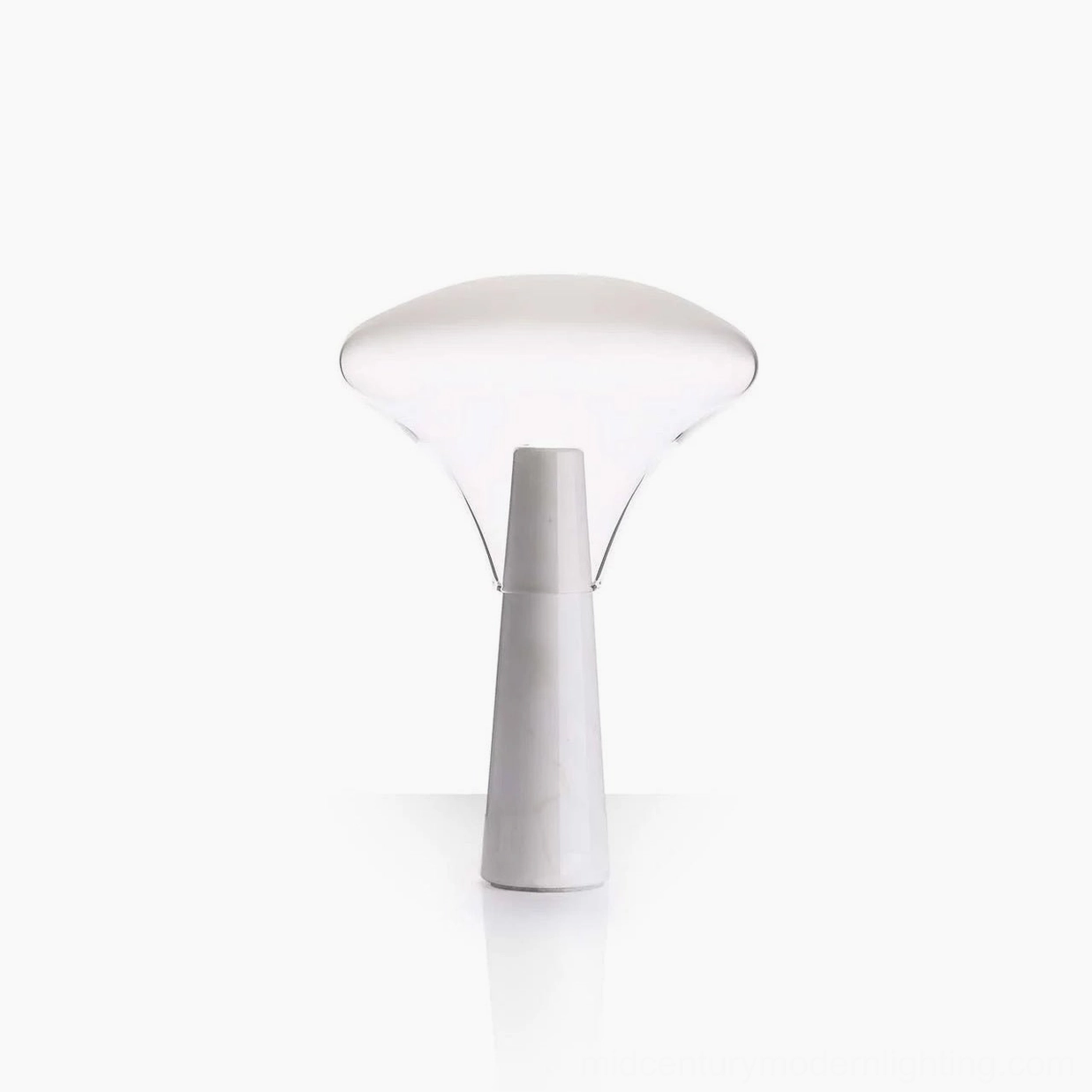 Compact Bella table lamp with white marble base and clear blown glass shade, minimalist form