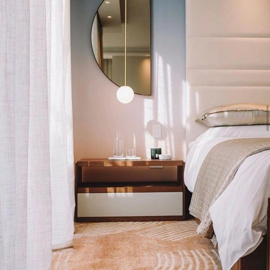 Compact brass globe pendant light suitable for intimate residential spaces and task lighting