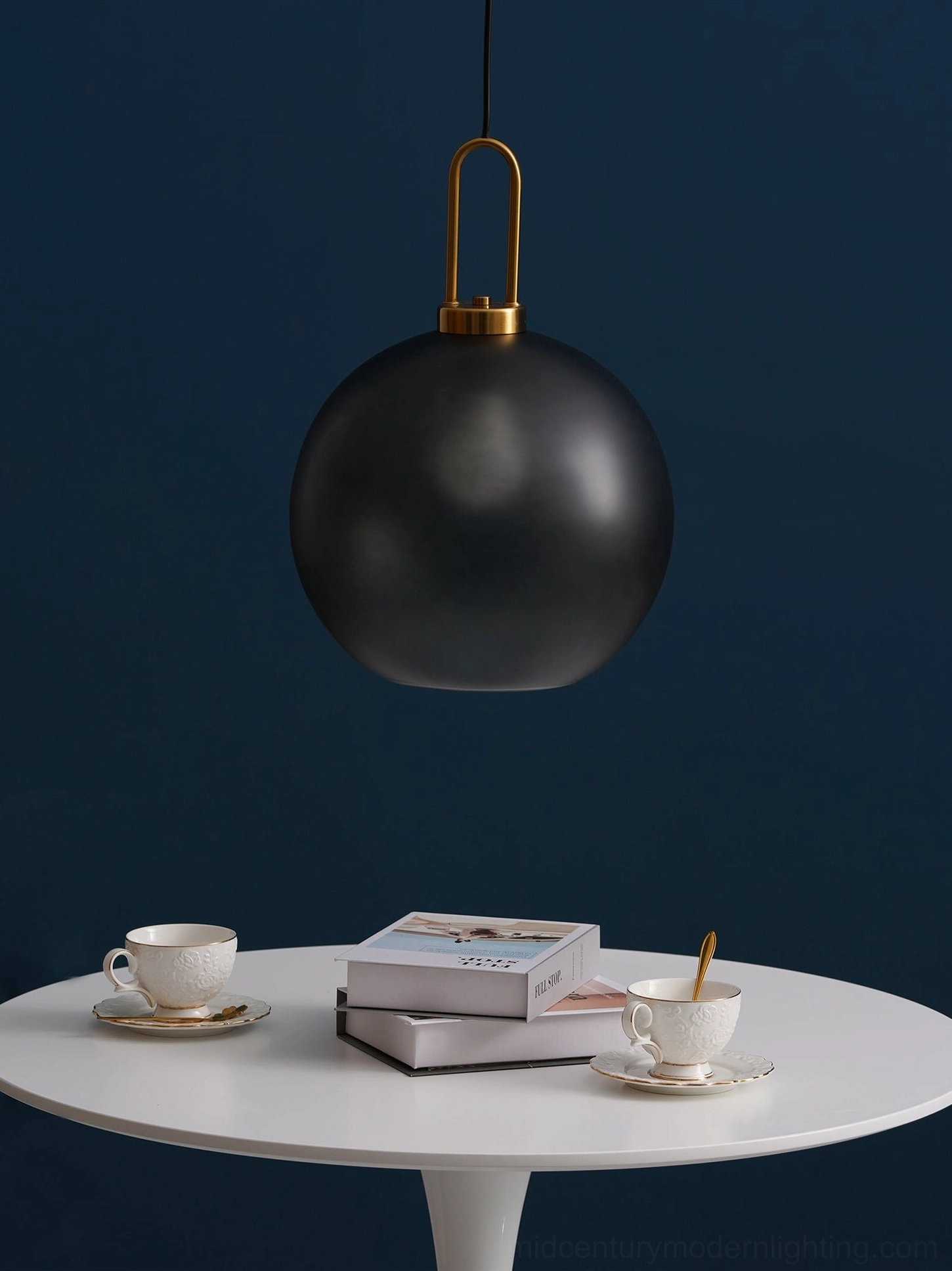 Compact capsule smoked glass pendant lamp in gold finish showing minimalist form and function